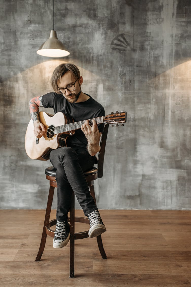 A Man Playing Acoustic Guitar