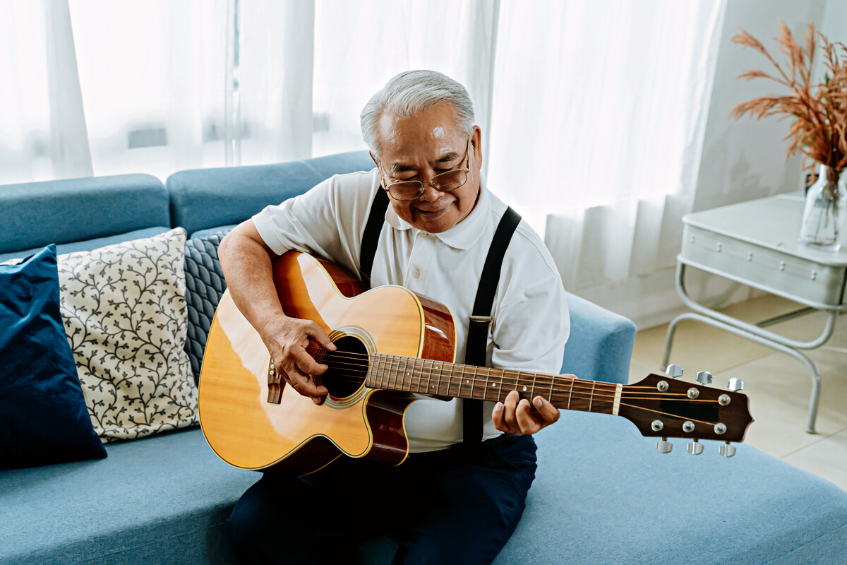 Elderly Man Playing the Guitar